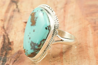 Genuine Royston Turquoise Stone set in Sterling Silver Ring. The Royston Turquoise Mine is located in Nye County, Nevada. Created by Navajo Artist Larson Lee. Signed by the artist.